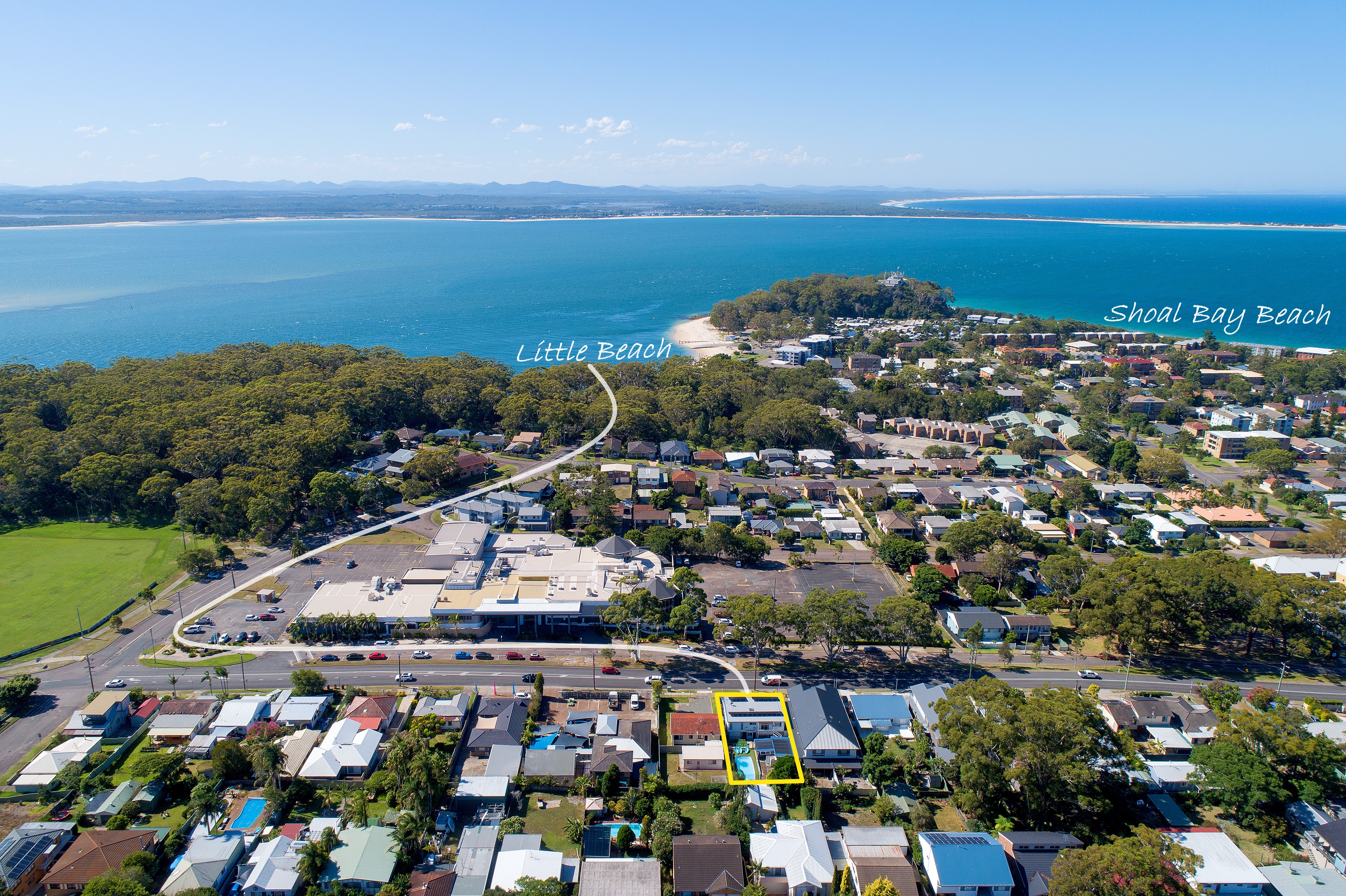 An aerial photo of the Beach and Bay Holiday House in Nelson Bay which shows how close it is to Little Beach