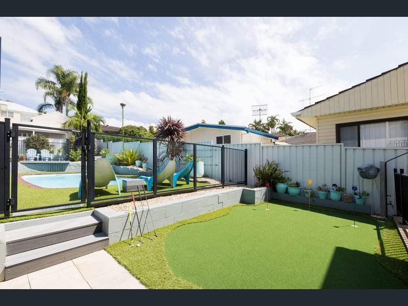 Backyard area overlooking pool